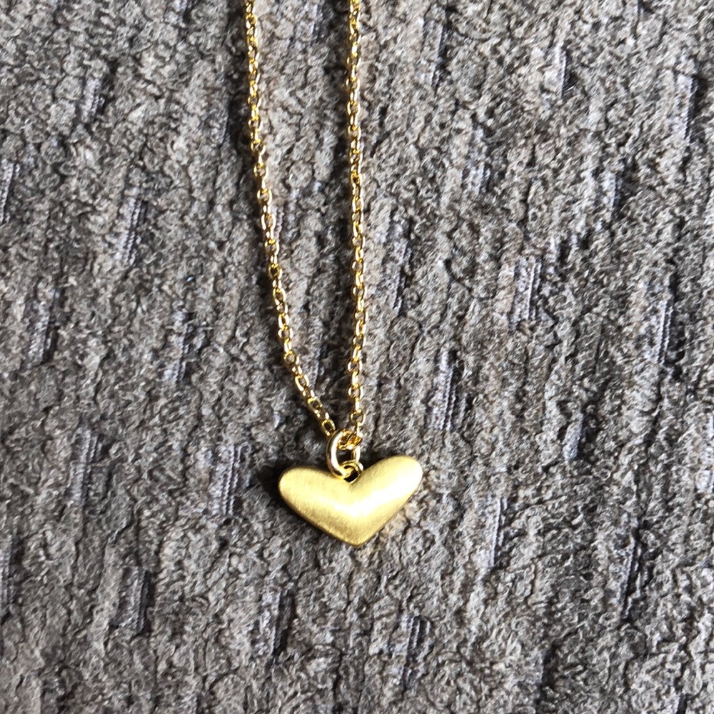 Gold heart charm necklace. Adjustable length.